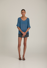 Joyeux sheer boxy top in steel blue styled with grey skort